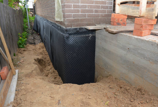 SJ Waterproofing Pros technician performing targeted Exterior Waterproofing assessment in Sterrett, AL